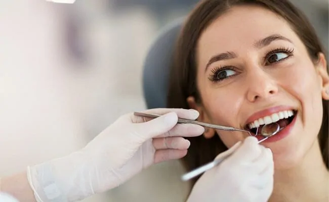 woman getting teeth cleaned